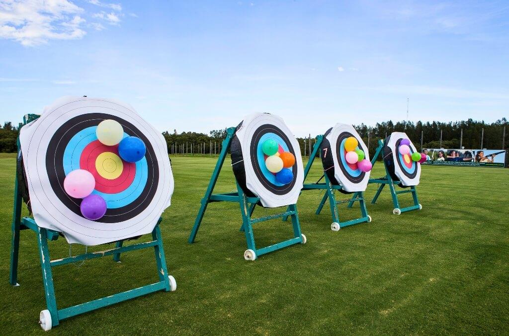 Image of archery targets with birthday balloons attached